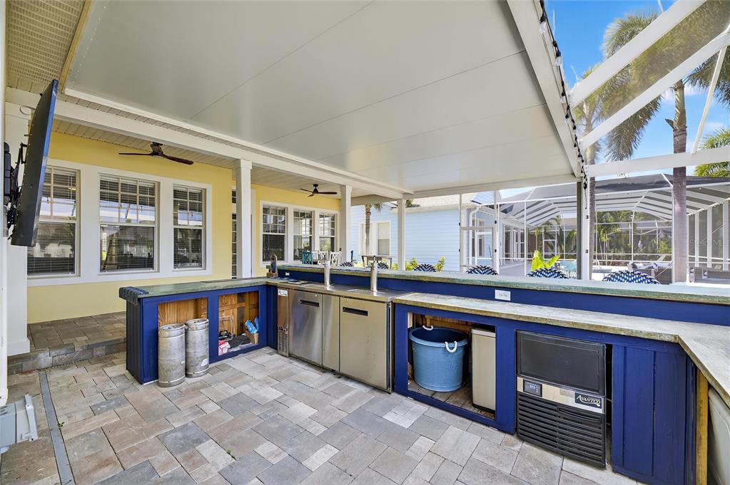 5720 Tortoise Place Apollo Beach, FL 33572 - Photo 50 of 83 a kitchen with stainless steel appliances granite countertop a stove and a sink