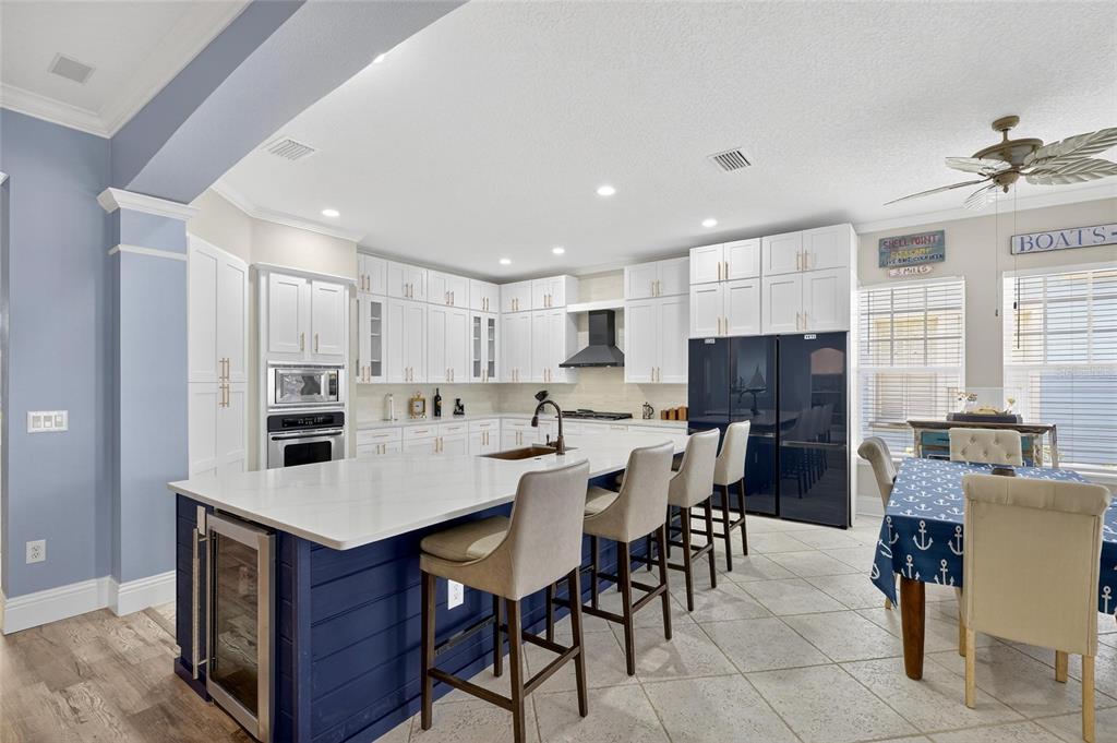 5720 Tortoise Place Apollo Beach, FL 33572 - Photo 9 of 83 a large kitchen with a table and chairs