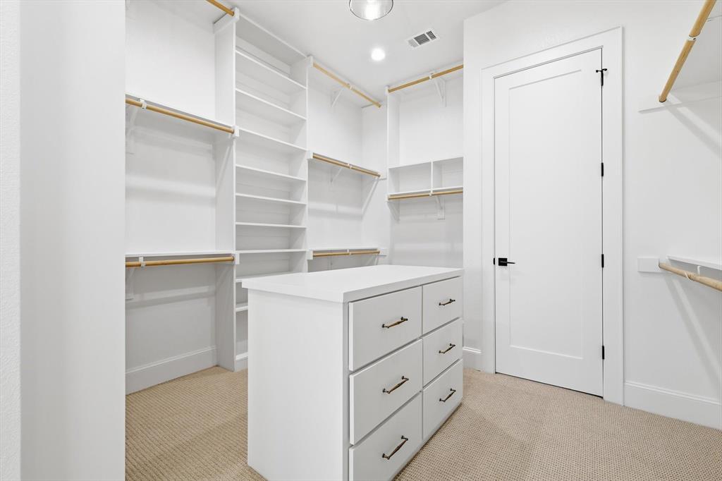122 Ozro Road Venus, TX 76084 - Photo 27 of 40 Large Primary Closet with 3 rows of racks.