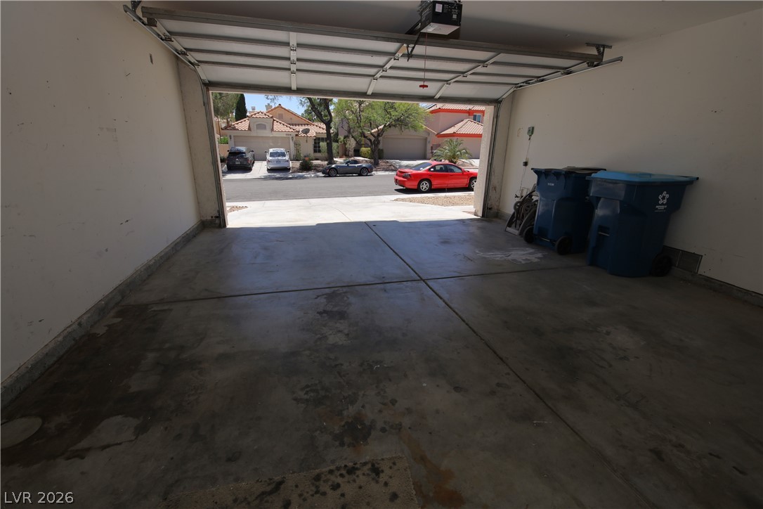 8220 Maplestar Road Las Vegas, NV 89128 - Photo 15 of 29 Secure parking is provided in this attached garage with an automatic door opener.