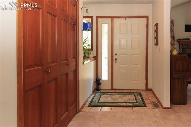 12020 Murphy Road Elbert, CO 80106 - Photo 3 of 39 Entrance to the home. Notice the closet and tile floors.