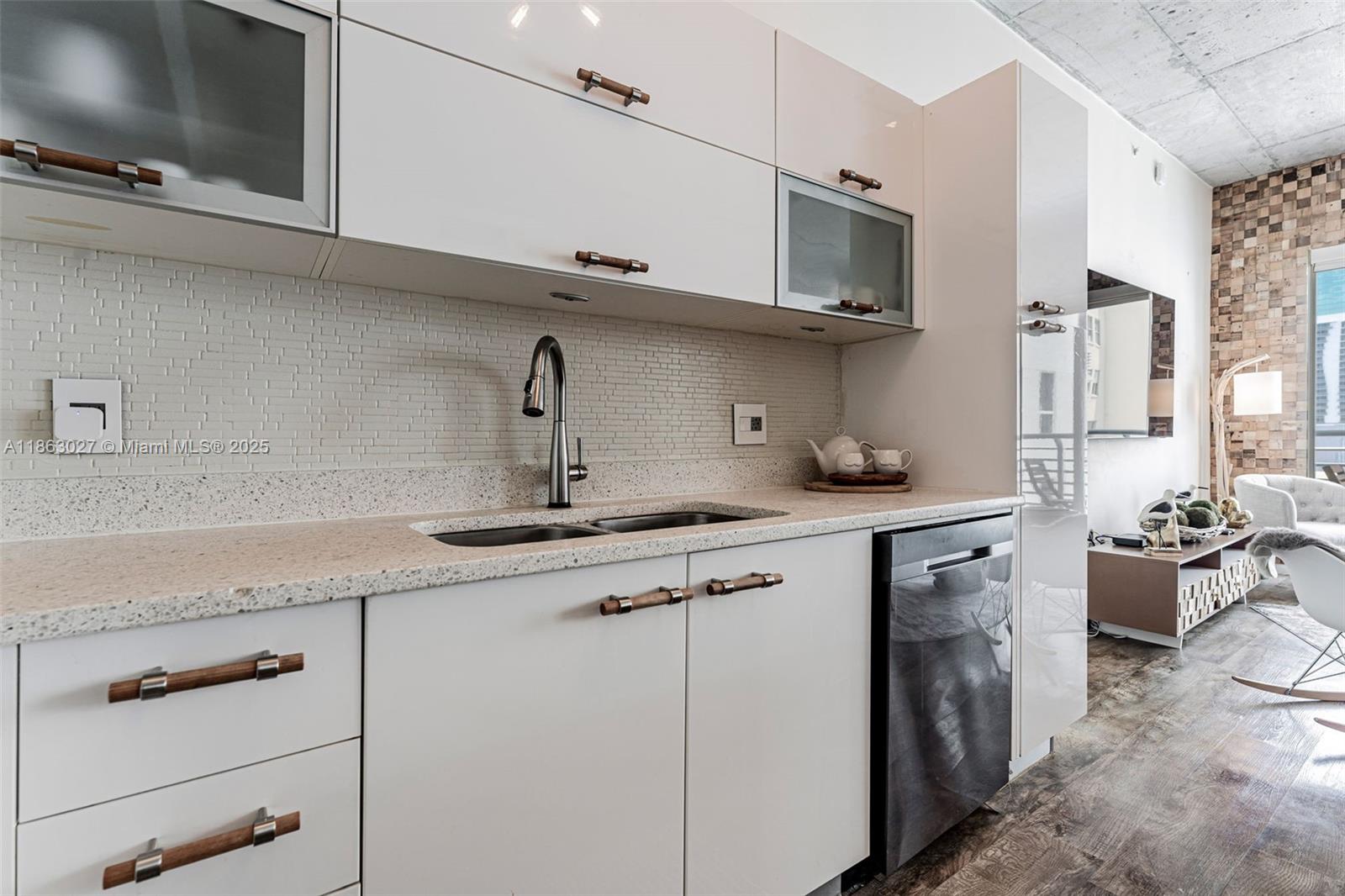 133 Northeast 2nd Avenue, Unit 1208 Miami, FL 33132 - Photo 13 of 33 a kitchen with stainless steel appliances granite countertop a sink and a stove