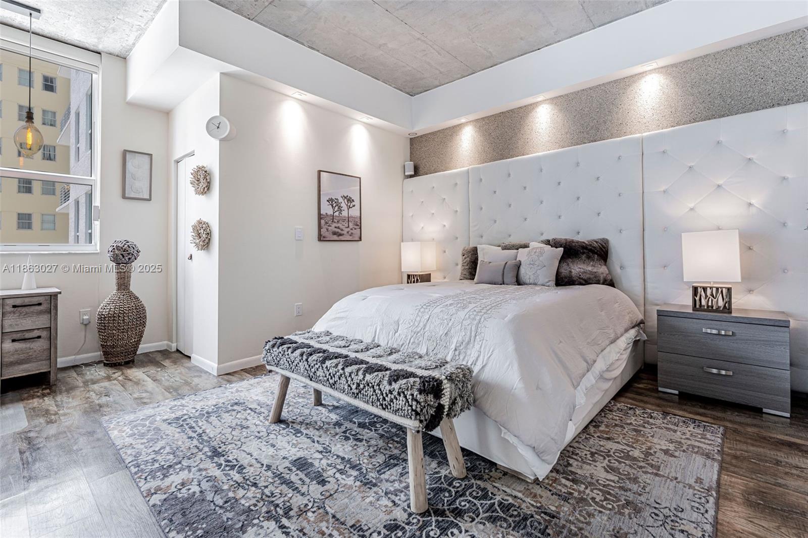 133 Northeast 2nd Avenue, Unit 1208 Miami, FL 33132 - Photo 16 of 33 a bedroom with a bed and a view kitchen