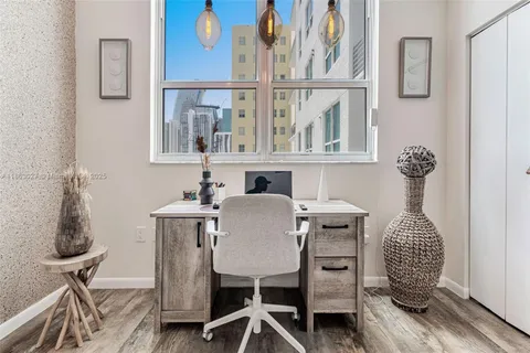 a very nice looking room with a large bed and a large mirror on the dresser