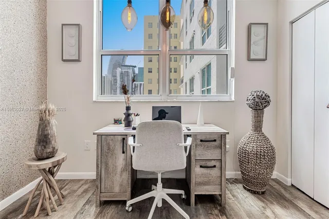 a very nice looking room with a large bed and a large mirror on the dresser