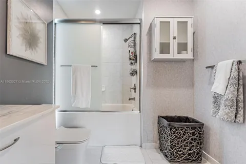 a spacious bedroom with a large bed and a couch