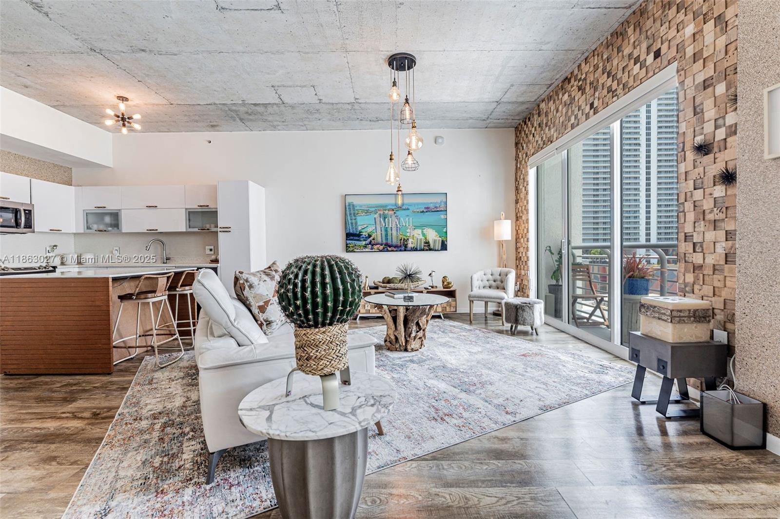 133 Northeast 2nd Avenue, Unit 1208 Miami, FL 33132 - Photo 6 of 33 a living room with furniture and a large window