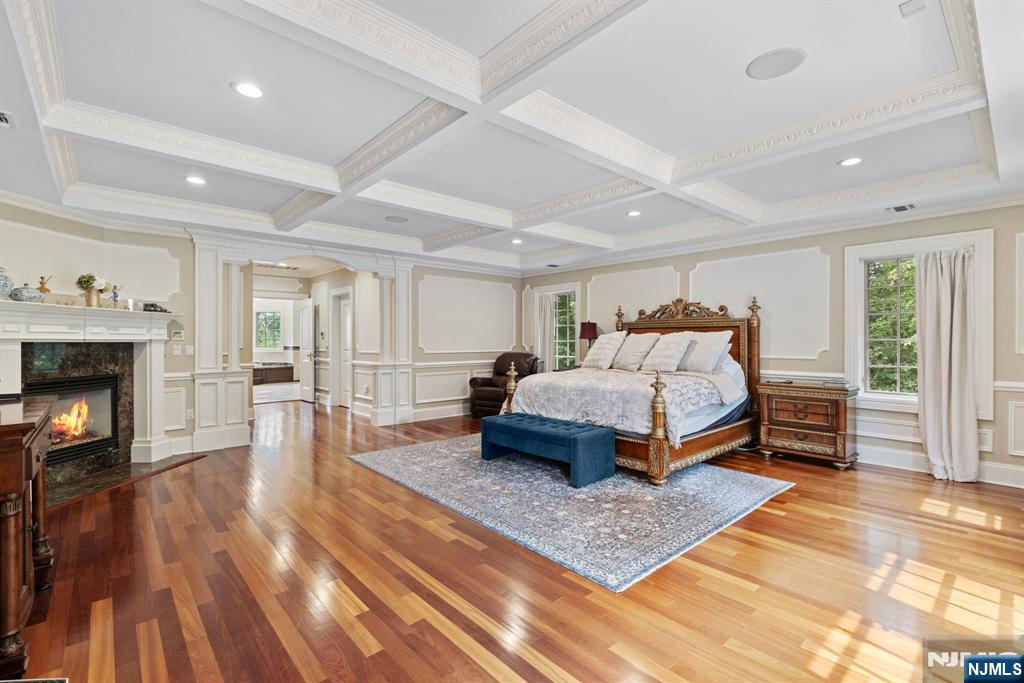 146 East Allendale Road Saddle River, NJ 07458 - Photo 12 of 28 a bedroom with a bed and a fireplace