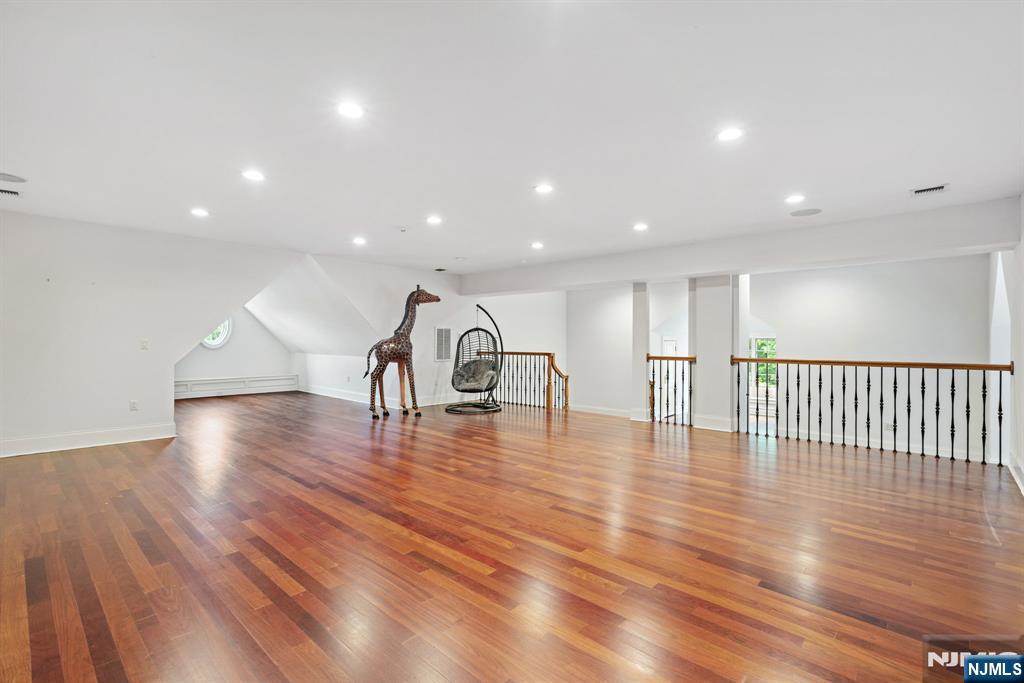 146 East Allendale Road Saddle River, NJ 07458 - Photo 17 of 28 a view of an empty room with wooden floor