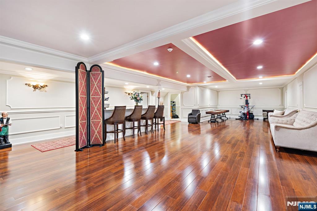 146 East Allendale Road Saddle River, NJ 07458 - Photo 20 of 28 a view of a dining hall with couches and wooden floor