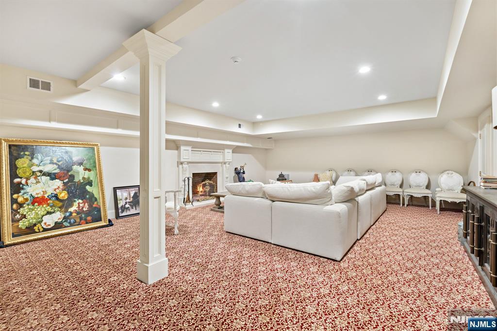 146 East Allendale Road Saddle River, NJ 07458 - Photo 21 of 28 a living room with furniture a painting on the wall and a rug