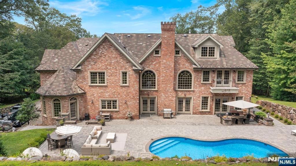 146 East Allendale Road Saddle River, NJ 07458 - Photo 25 of 28 a view of a yard with a sitting area