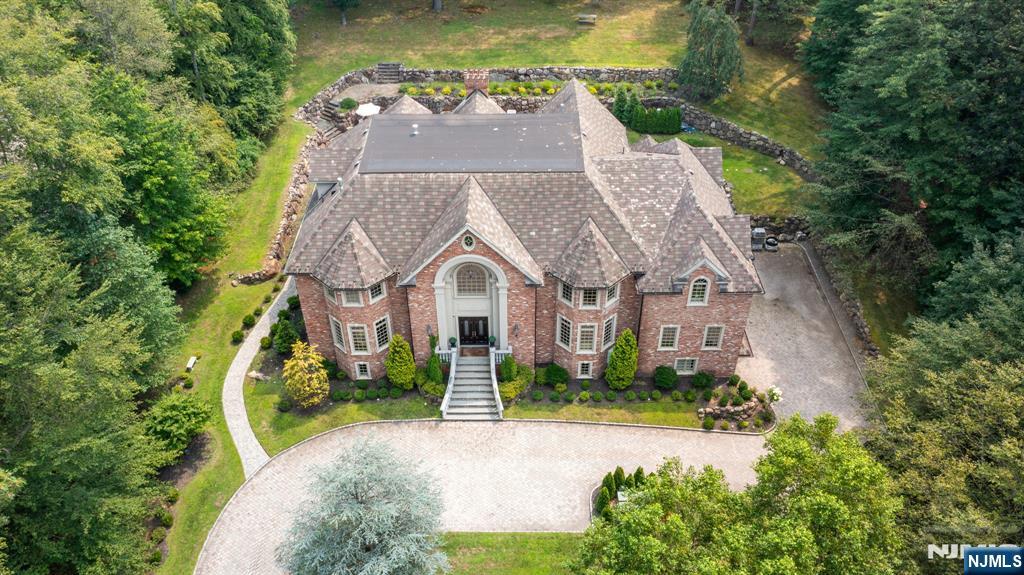 146 East Allendale Road Saddle River, NJ 07458 - Photo 28 of 28 an aerial view of a house with a yard table and chairs