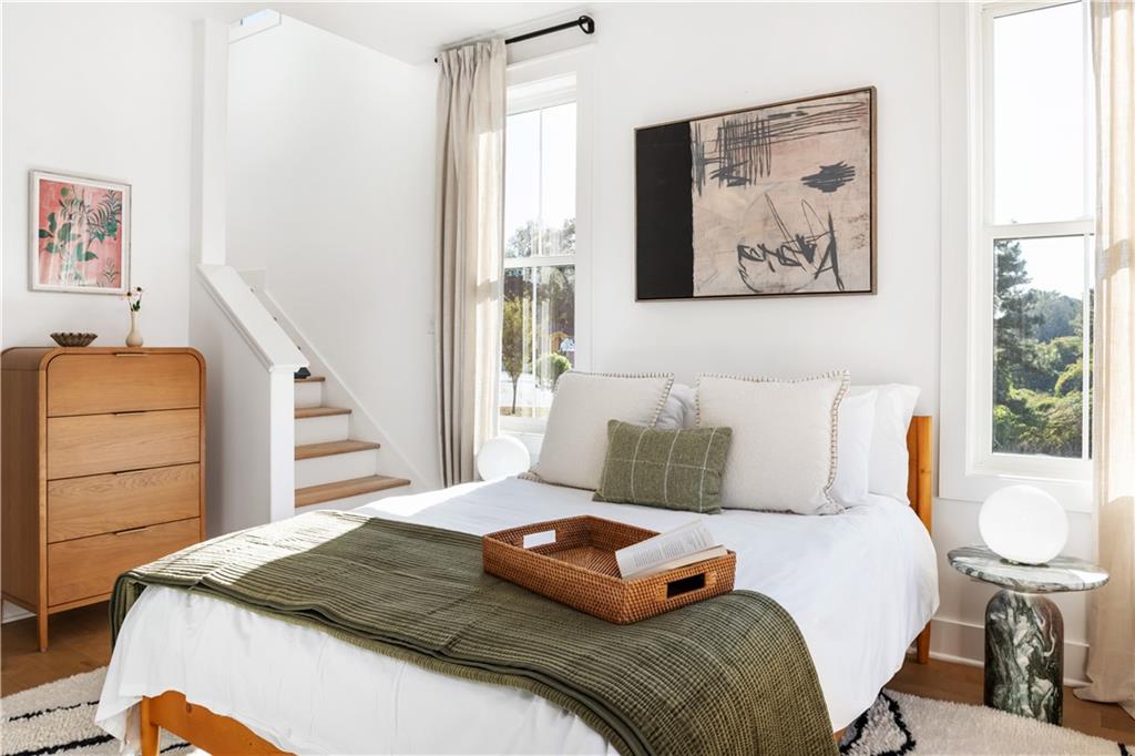 1160 Boulevard Southeast, Unit 11 Atlanta, GA 30312 - Photo 12 of 32 a bedroom with a bed and a dresser in it