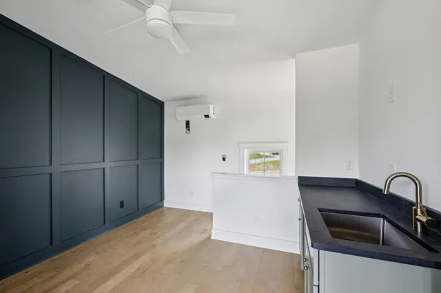 a kitchen with stainless steel appliances granite countertop a stove and a refrigerator