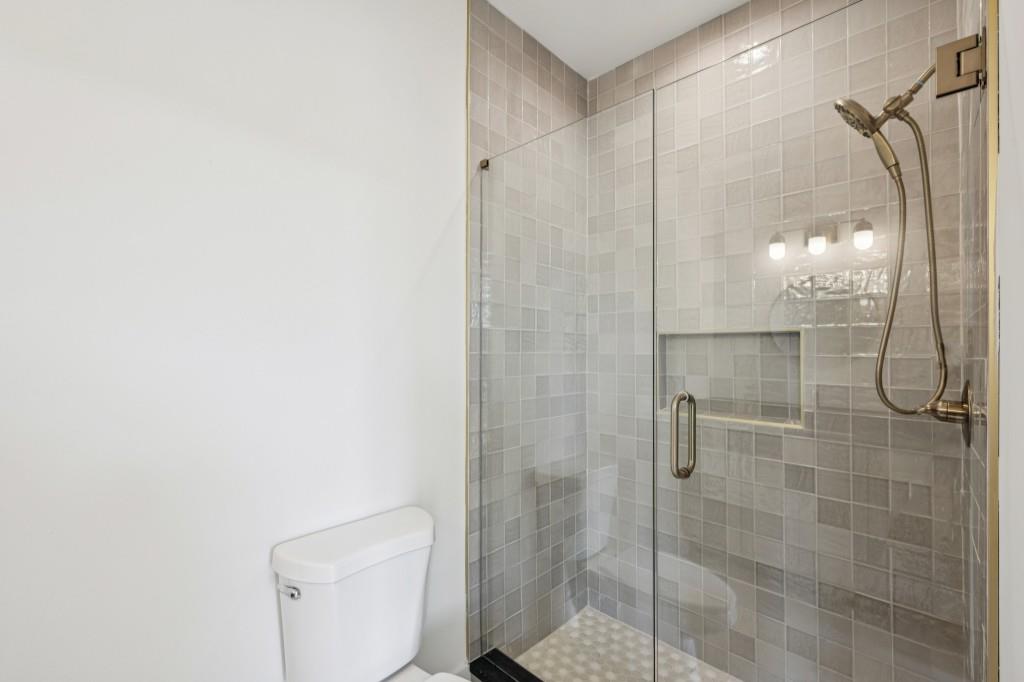 1160 Boulevard Southeast, Unit 11 Atlanta, GA 30312 - Photo 18 of 32 a bathroom with a shower and toilet