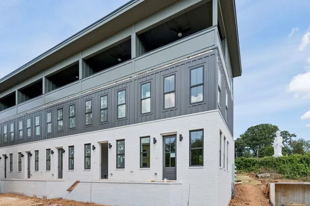 a kitchen with stainless steel appliances a sink stove and cabinets