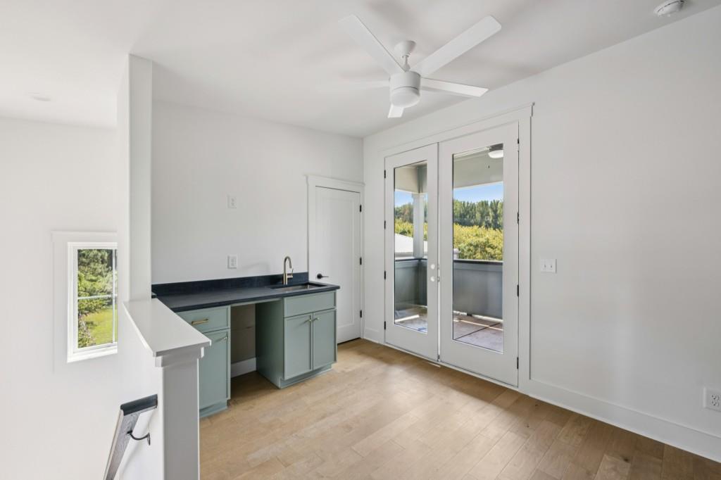 1160 Boulevard Southeast, Unit 11 Atlanta, GA 30312 - Photo 24 of 32 a kitchen with stainless steel appliances granite countertop a stove and a refrigerator