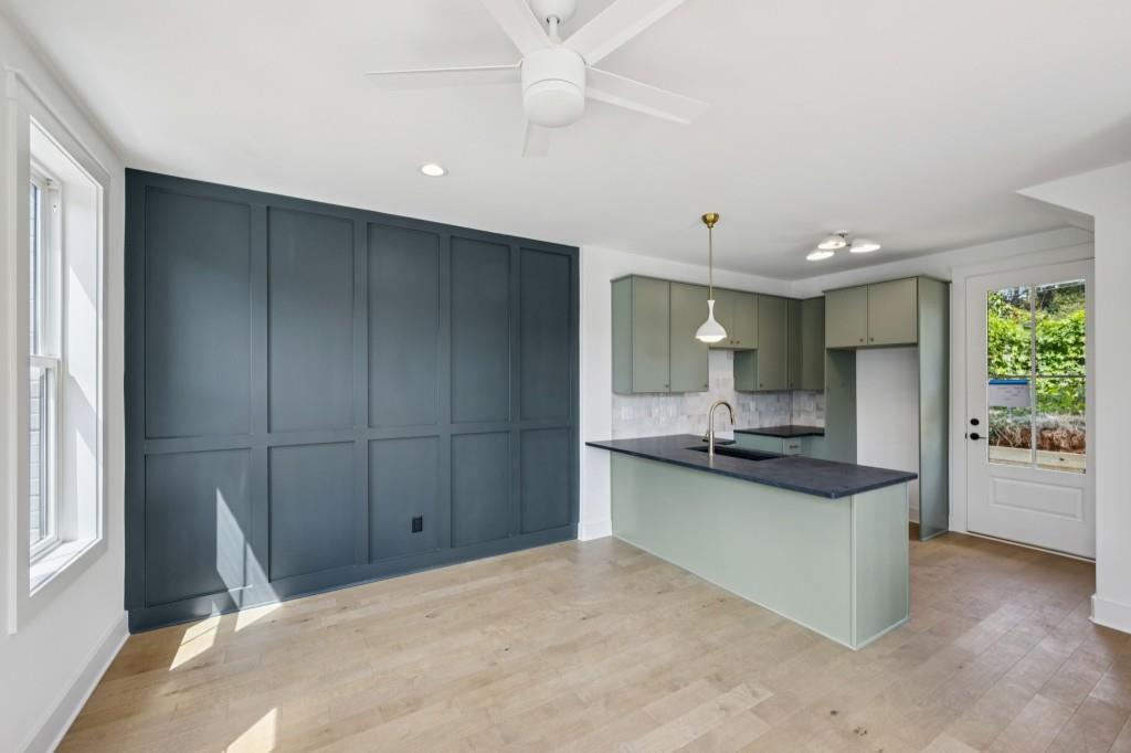 1160 Boulevard Southeast, Unit 11 Atlanta, GA 30312 - Photo 4 of 32 a kitchen with stainless steel appliances a sink stove and cabinets