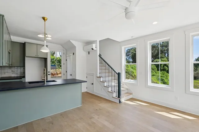 an empty room with windows and closet