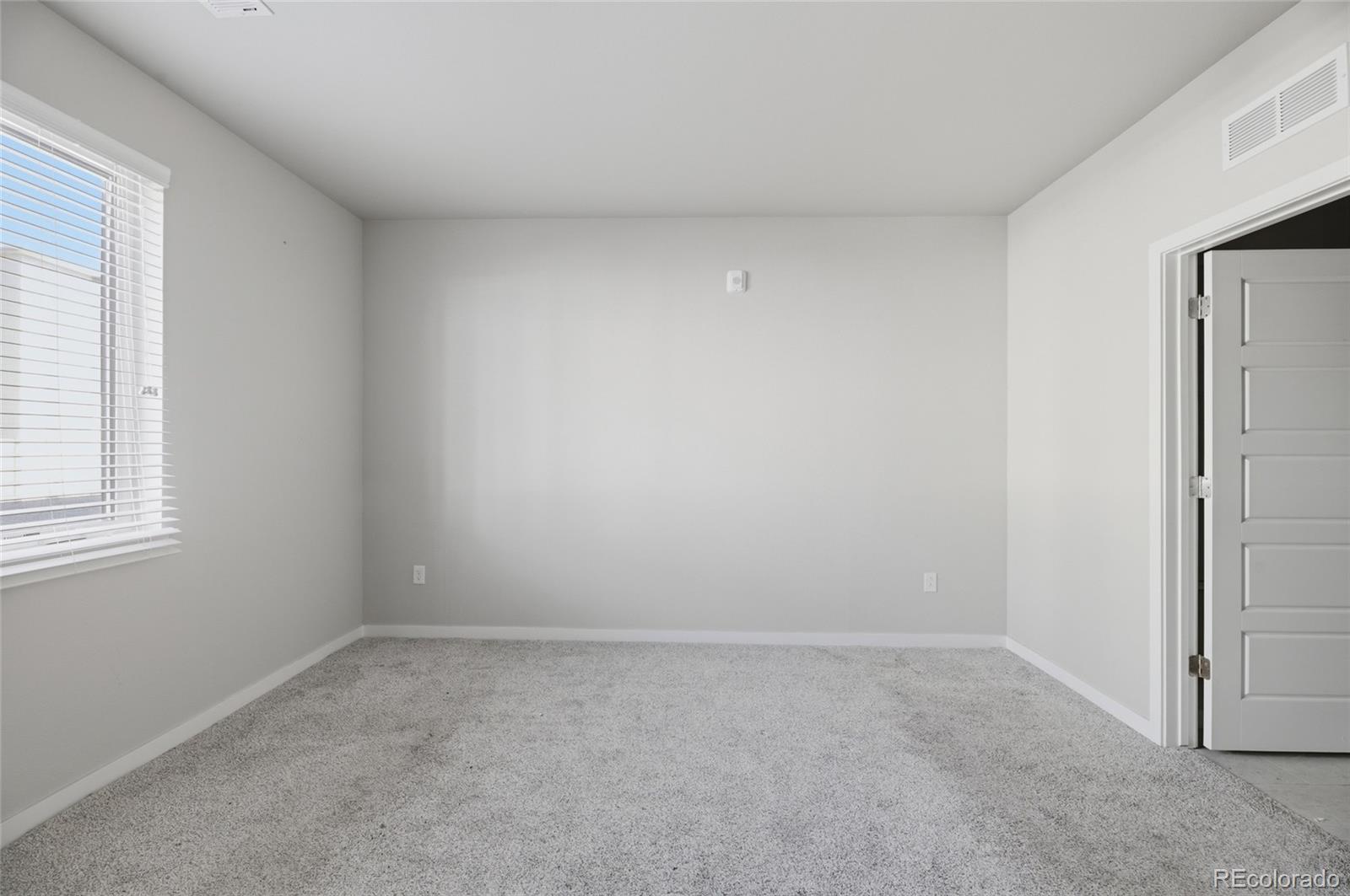 9291 Twenty Mile Road, Unit 207 Parker, CO 80134 - Photo 14 of 25 an empty room with windows