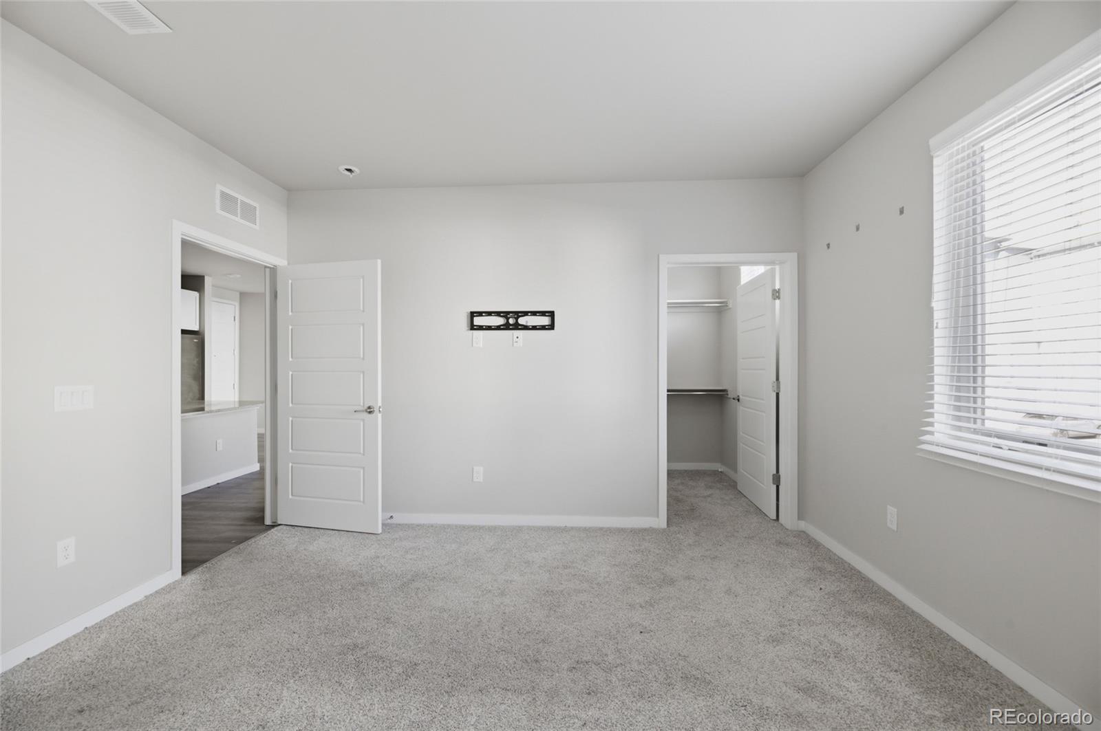 9291 Twenty Mile Road, Unit 207 Parker, CO 80134 - Photo 16 of 25 a view of an empty room with a window