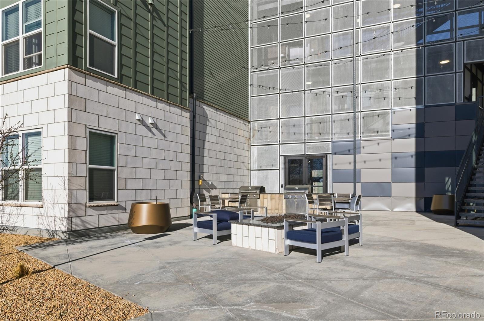 9291 Twenty Mile Road, Unit 207 Parker, CO 80134 - Photo 24 of 25 a building outdoor space with patio furniture