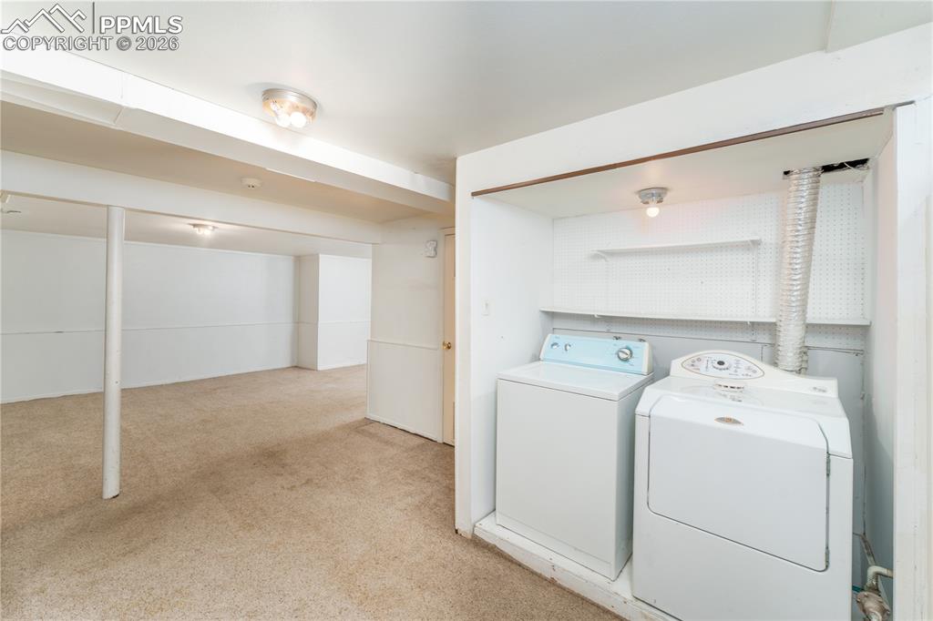 2818 Templeton Gap Road Colorado Springs, CO 80907 - Photo 16 of 27 a view of storage and utility room with washer and dryer