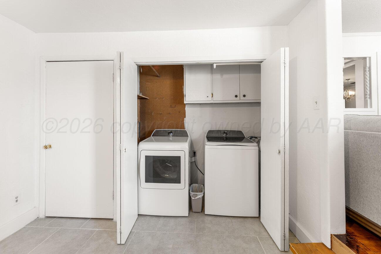 1109 Callahan Street Amarillo, TX 79106 - Photo 11 of 23 a storage room with washer and dryer