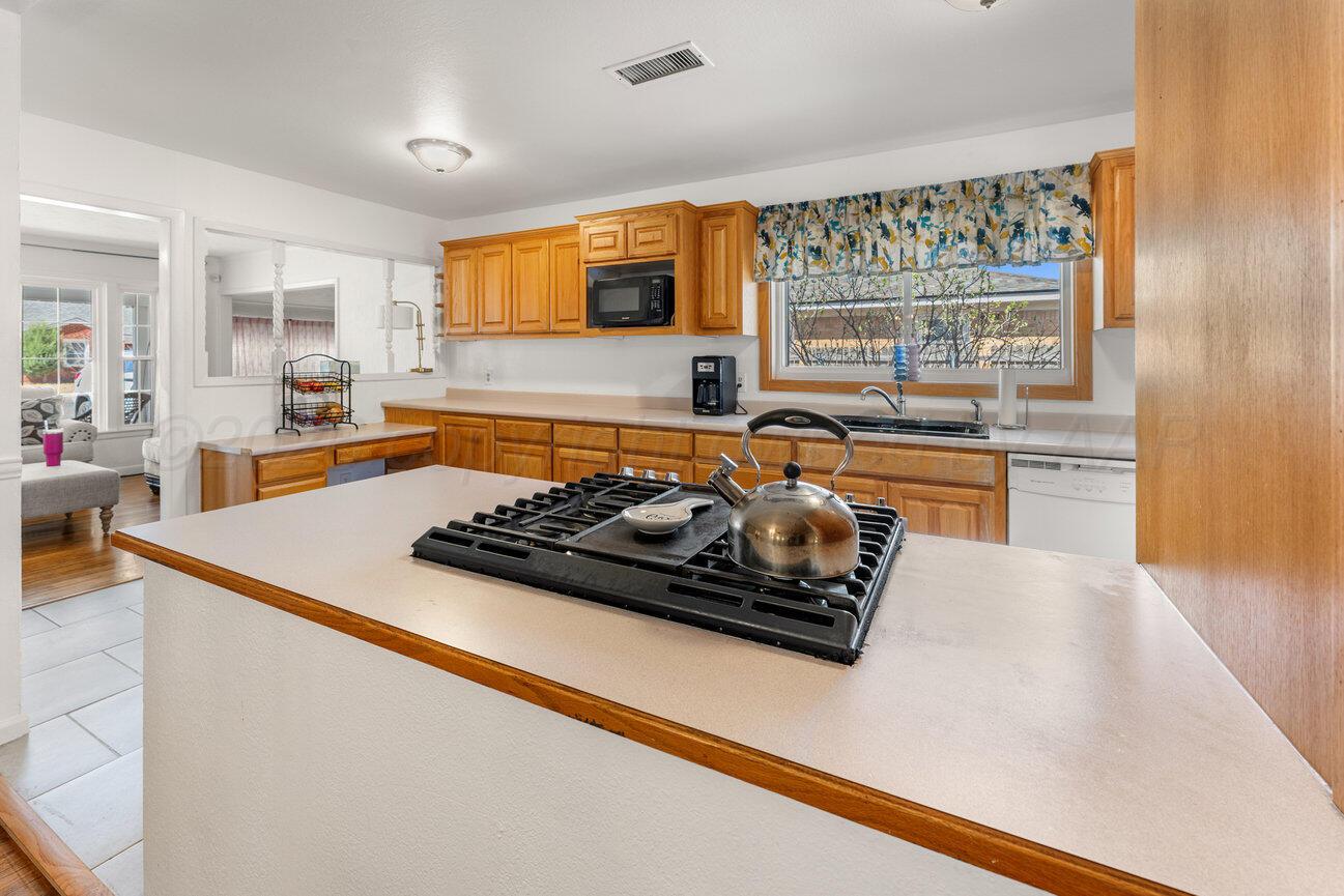 1109 Callahan Street Amarillo, TX 79106 - Photo 12 of 23 a large kitchen with a stove and a refrigerator