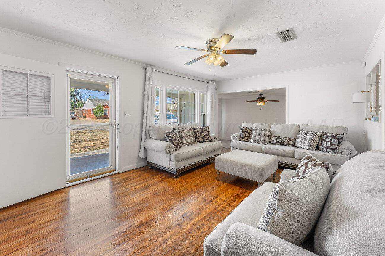 1109 Callahan Street Amarillo, TX 79106 - Photo 15 of 23 a living room with furniture and a chandelier