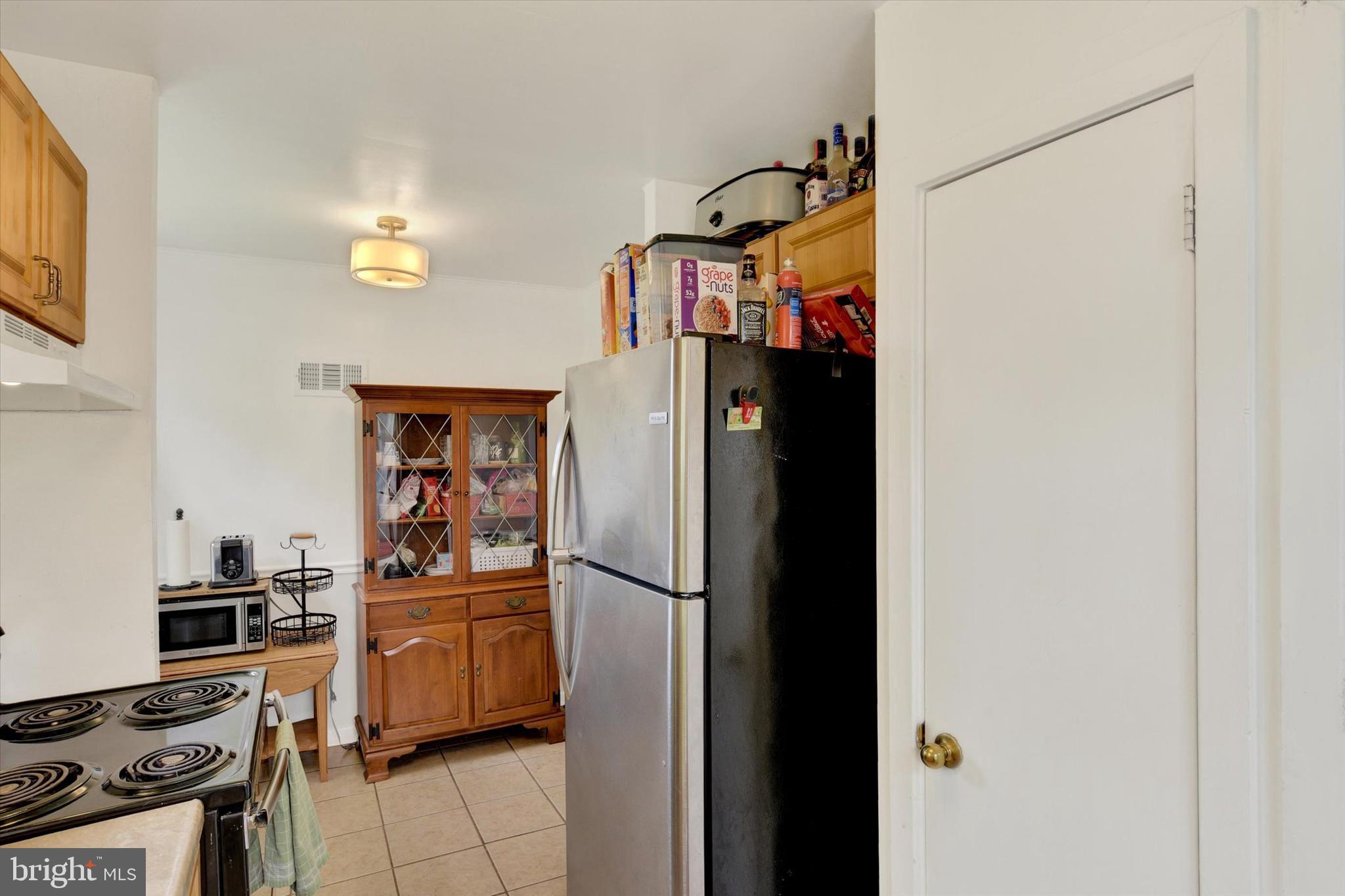 4712 Ruth Ann Street Harrisburg, PA 17109 - Photo 10 of 26 a kitchen view of a refrigerator and a stove