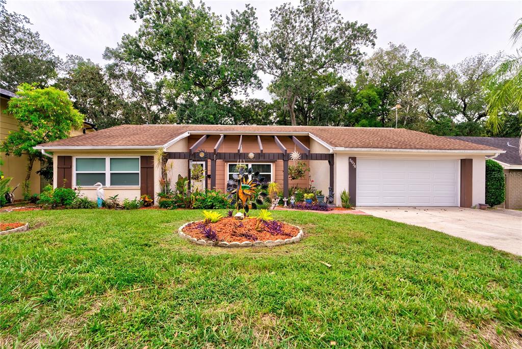 a aerial view of a house and a yard