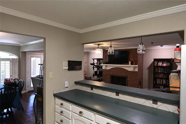 a kitchen with a refrigerator and a stove
