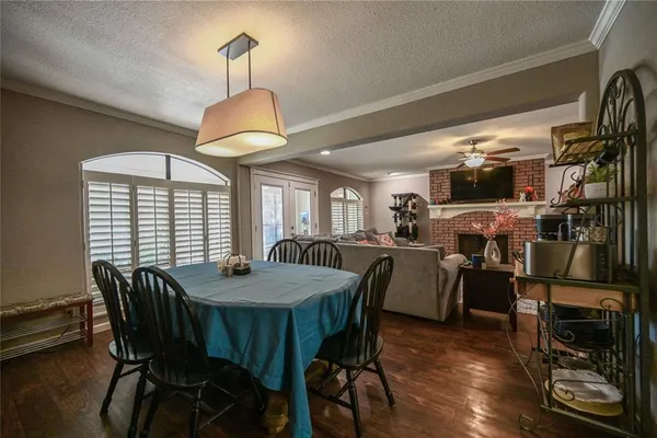 a dining room with furniture and window