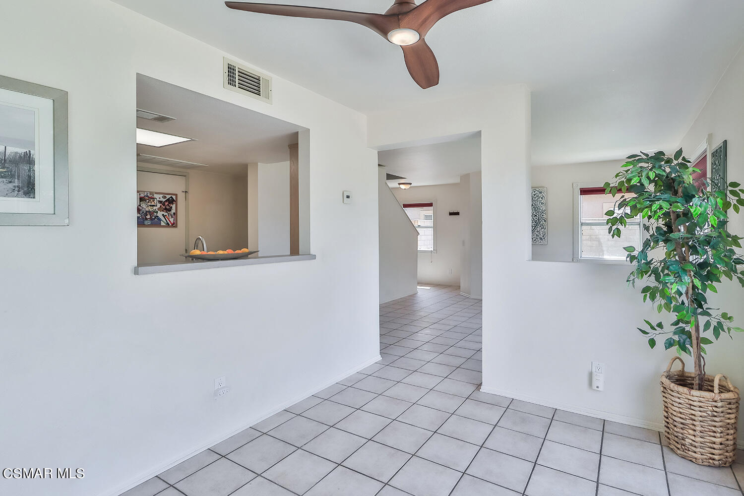 4498 Apricot Road, Unit B Simi Valley, CA 93063 - Photo 11 of 36 a view of a hallway with wooden floor and a potted plant