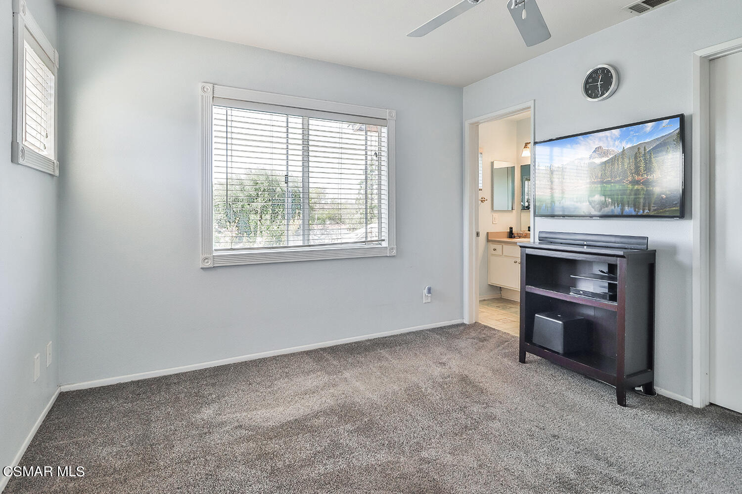 4498 Apricot Road, Unit B Simi Valley, CA 93063 - Photo 18 of 36 an empty room with windows cabinet and fireplace
