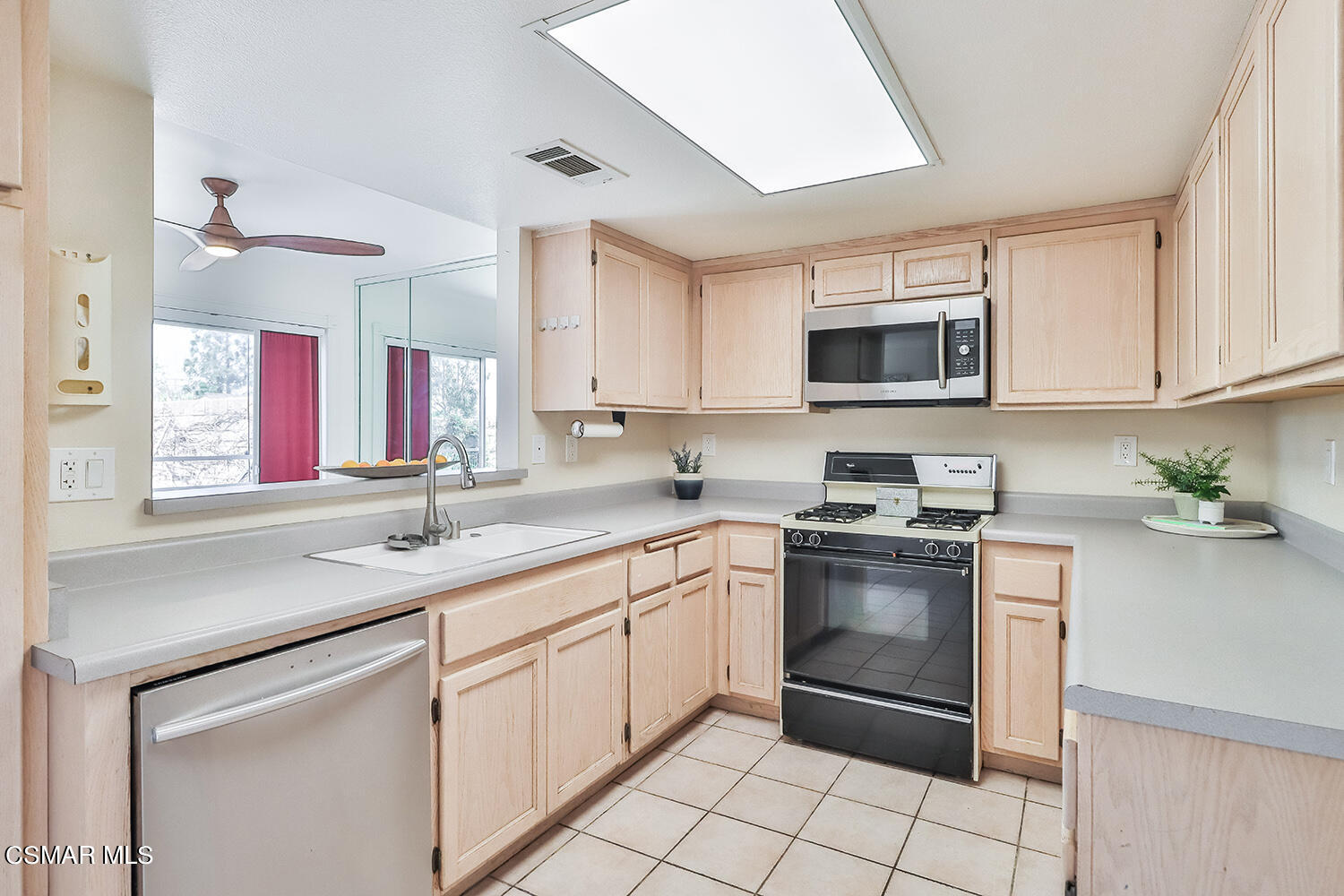 4498 Apricot Road, Unit B Simi Valley, CA 93063 - Photo 7 of 36 a kitchen with stainless steel appliances granite countertop a sink and a stove
