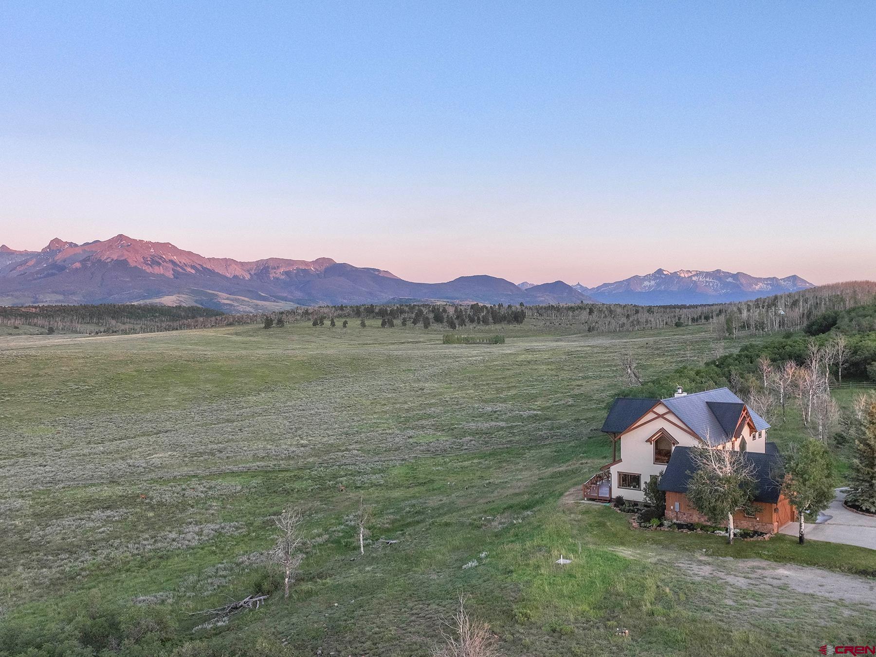 4234 Brown Ranch Road Placerville, CO 81430 - Photo 1 of 16 a view of a lake with a mountain in the background