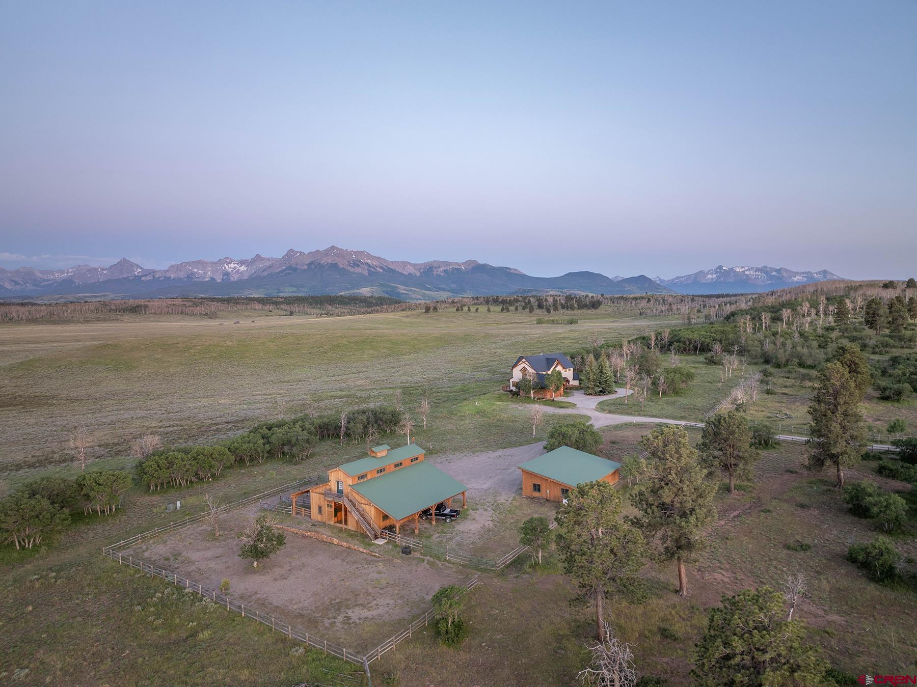 4234 Brown Ranch Road Placerville, CO 81430 - Photo 2 of 16 a view of a lake with a mountain