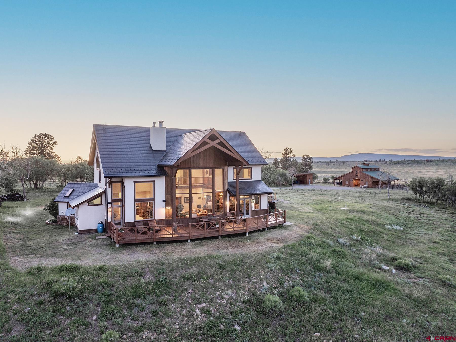 4234 Brown Ranch Road Placerville, CO 81430 - Photo 3 of 16 a view of a house with a yard