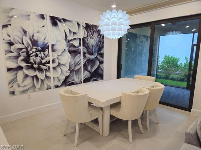 Undisclosed Address Naples, FL 34119 - Photo 16 of 50 a dining room with furniture and window