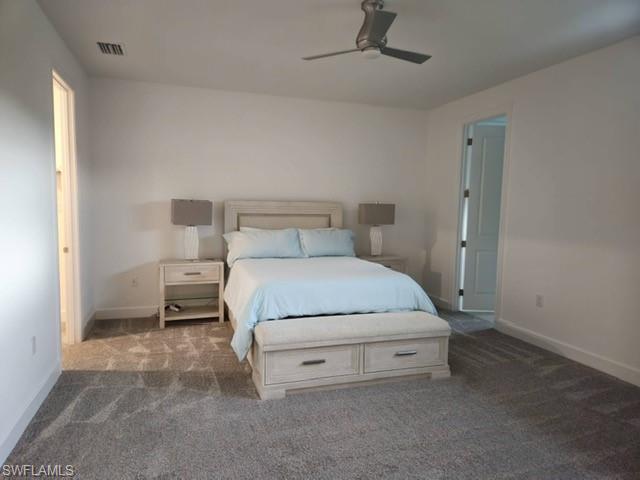 Undisclosed Address Naples, FL 34119 - Photo 21 of 50 a room with a bed and a table