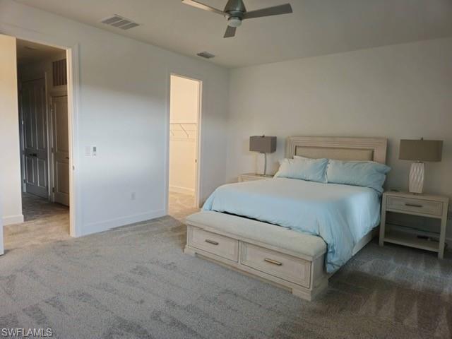 Undisclosed Address Naples, FL 34119 - Photo 22 of 50 a room with a bed and a ceiling fan