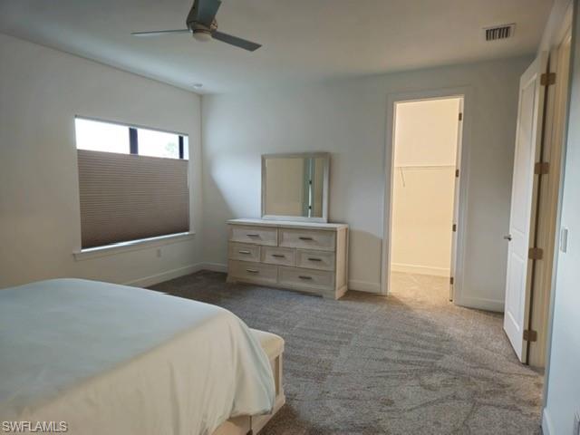 Undisclosed Address Naples, FL 34119 - Photo 27 of 50 a bedroom with a bed and a television