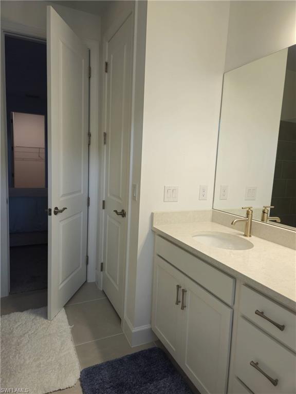 Undisclosed Address Naples, FL 34119 - Photo 29 of 50 a bathroom with a sink and a mirror