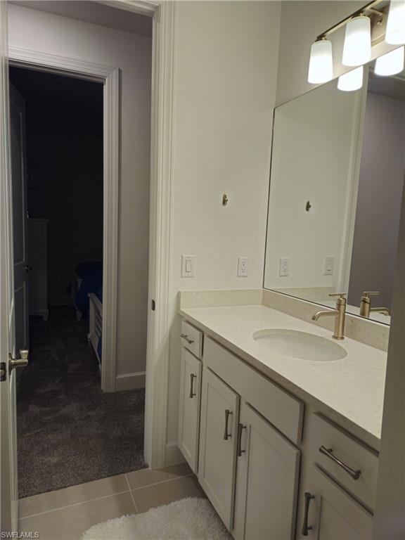 Undisclosed Address Naples, FL 34119 - Photo 32 of 50 a bathroom with a sink and mirror