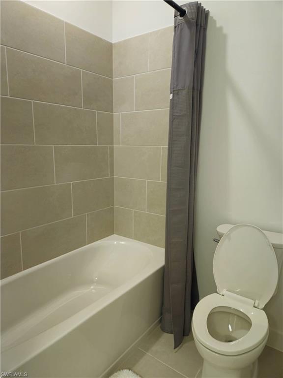 Undisclosed Address Naples, FL 34119 - Photo 33 of 50 a white toilet sitting next to a bath tub