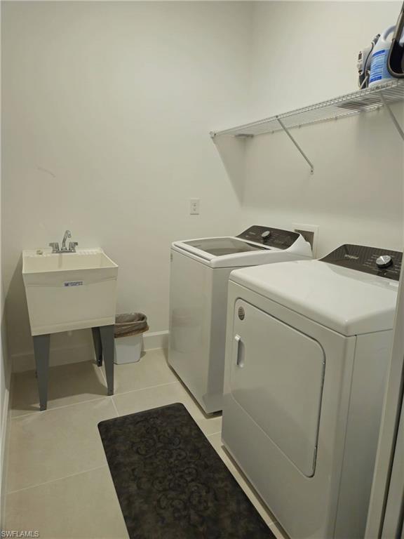 Undisclosed Address Naples, FL 34119 - Photo 38 of 50 a utility room with dryer and washer