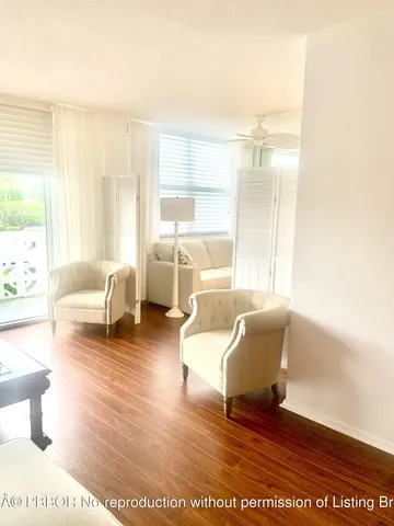 a kitchen with white cabinets and sink